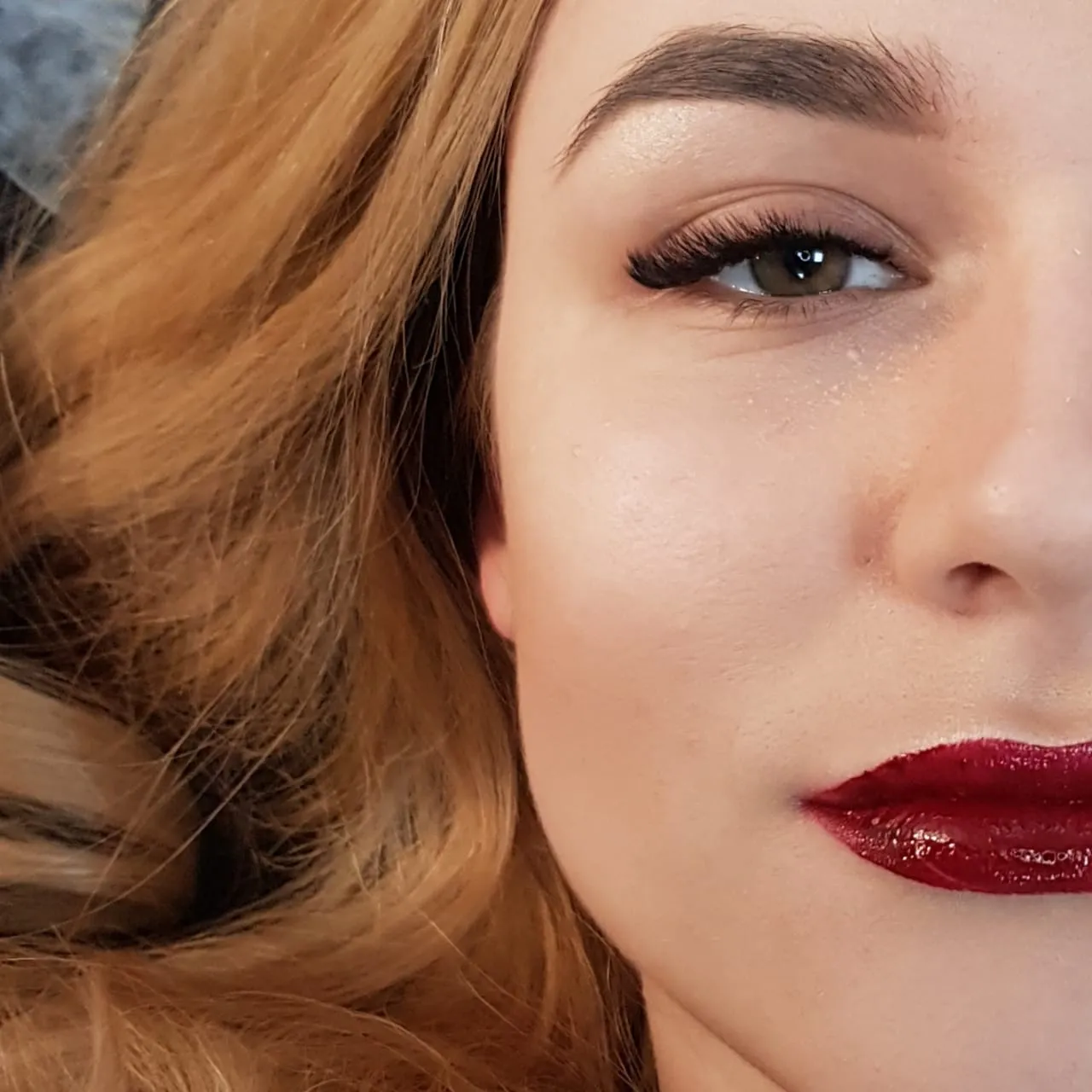 Portrait detail showing a Cat Eye lash extension result with outer-eye emphasis.