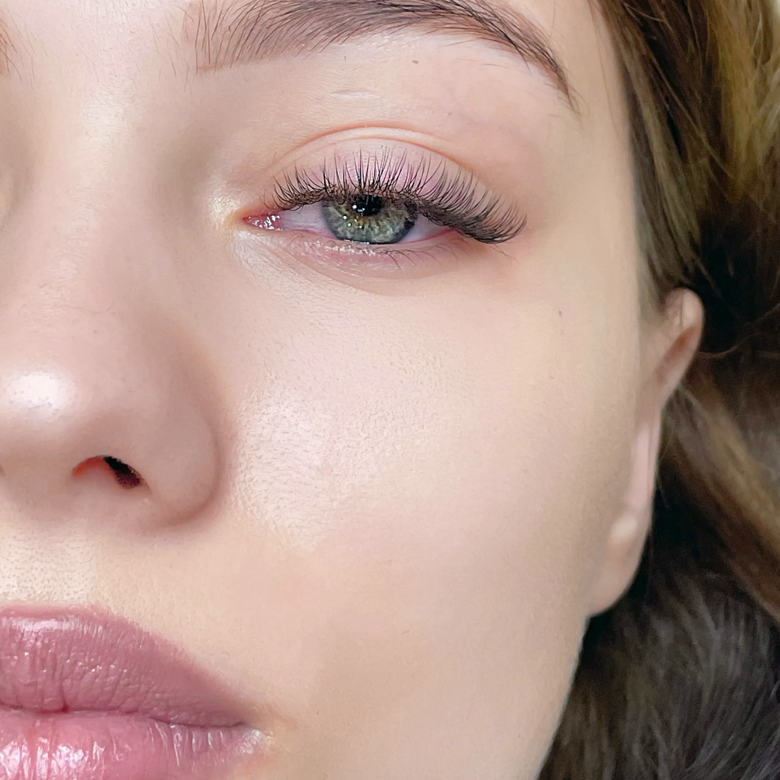 Portrait detail showing a light Cat Eye lash extension result.